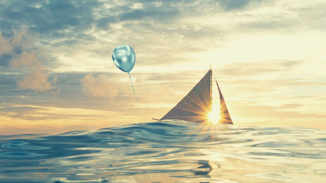 balloon hovering over a boat